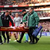 Laura Wienroither of Arsenal leaves the field on a stretcher after receiving medical treatment during the UEFA Women's Champions League semi-final 2nd leg match between Arsenal and VfL Wolfsburg at Emirates Stadium on May 01, 2023 in London, England. (Photo by Richard Heathcote/Getty Images)