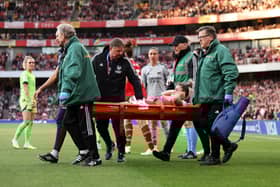 Laura Wienroither of Arsenal leaves the field on a stretcher after receiving medical treatment during the UEFA Women's Champions League semi-final 2nd leg match between Arsenal and VfL Wolfsburg at Emirates Stadium on May 01, 2023 in London, England. (Photo by Richard Heathcote/Getty Images)