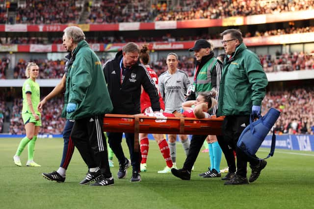 Laura Wienroither of Arsenal leaves the field on a stretcher after receiving medical treatment during the UEFA Women's Champions League semi-final 2nd leg match between Arsenal and VfL Wolfsburg at Emirates Stadium on May 01, 2023 in London, England. (Photo by Richard Heathcote/Getty Images)