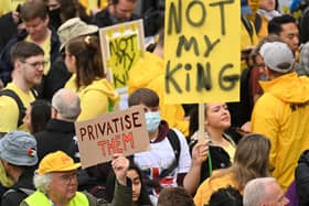 Protesters hold up placards saying ‘Not My King’ in Trafalgar Square. (Photo by SEBASTIEN BOZON/POOL/AFP via Getty Images)