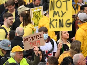 Protesters hold up placards saying ‘Not My King’ in Trafalgar Square. (Photo by SEBASTIEN BOZON/POOL/AFP via Getty Images)