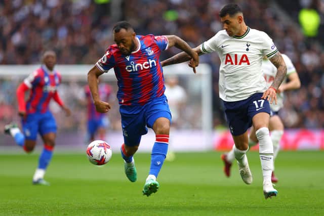 Jordan Ayew of Crystal Palace under pressure from Cristian Romero of Tottenham Hotspur. (Photo by Clive Rose/Getty Images)