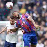 Jordan Ayew of Crystal Palace jumps for the ball with Pierre-Emile Hojbjerg of Tottenham Hotspur (Photo by Warren Little/Getty Images)