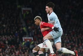  Marcus Rashford of Manchester United in action with Declan Rice of West Ham United during the Premier League match between Manchester United and West Ham United at Old Trafford on January 22, 2022 in Manchester, England. (Photo by Matthew Peters/Manchester United via Getty Images)