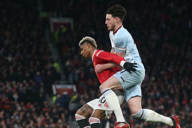  Marcus Rashford of Manchester United in action with Declan Rice of West Ham United during the Premier League match between Manchester United and West Ham United at Old Trafford on January 22, 2022 in Manchester, England. (Photo by Matthew Peters/Manchester United via Getty Images)