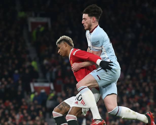  Marcus Rashford of Manchester United in action with Declan Rice of West Ham United during the Premier League match between Manchester United and West Ham United at Old Trafford on January 22, 2022 in Manchester, England. (Photo by Matthew Peters/Manchester United via Getty Images)