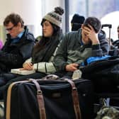 Passengers wait in the South Terminal building at London Gatwick Airport after a drone incident.  (Photo by Jack Taylor/Getty Images)