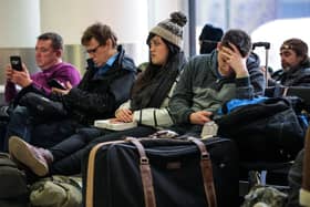 Passengers wait in the South Terminal building at London Gatwick Airport after a drone incident.  (Photo by Jack Taylor/Getty Images)
