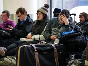 Passengers wait in the South Terminal building at London Gatwick Airport after a drone incident.  (Photo by Jack Taylor/Getty Images)