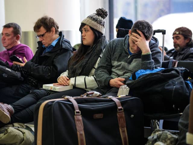 Passengers wait in the South Terminal building at London Gatwick Airport after a drone incident.  (Photo by Jack Taylor/Getty Images)