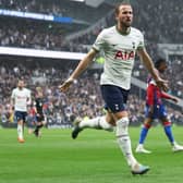 Tottenham Hotspur’s English striker Harry Kane (C) celebrates scoring his team’s first goal during the English Premier League  (Photo by ISABEL INFANTES/AFP via Getty Images)