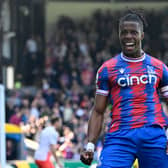Crystal Palace’s Ivorian striker Wilfried Zaha celebrates after scoring their second goal during the English Premier League football match   (Photo by JUSTIN TALLIS/AFP via Getty Images)