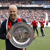 Feyenoord coach Arne Slot celebrates with the championship trophy after winning the Dutch Eredivisie (Photo by MAURICE VAN STEEN/ANP/AFP via Getty Images)