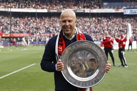 Feyenoord coach Arne Slot celebrates with the championship trophy after winning the Dutch Eredivisie (Photo by MAURICE VAN STEEN/ANP/AFP via Getty Images)