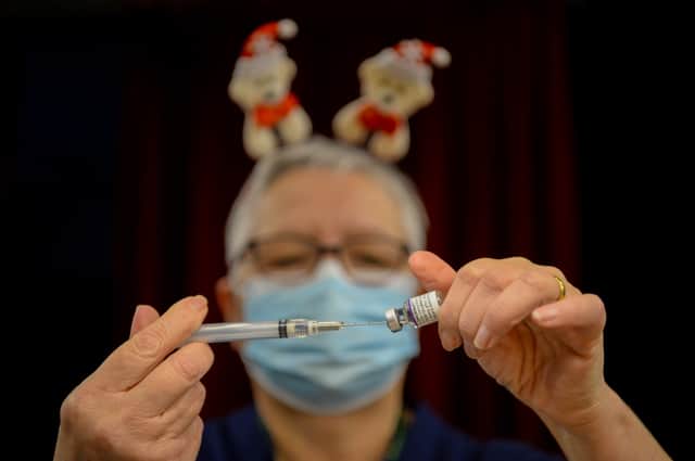 Pfizer BioNTech vaccines are prepared at Army Reserve Centre on December 23, 2021 in Poole, England. (Photo: Getty)