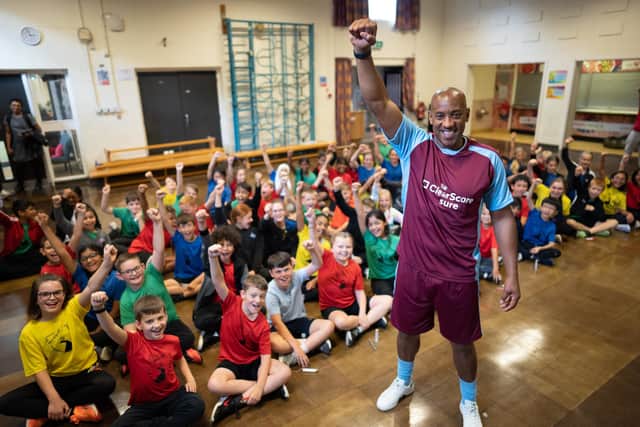 Local legend and former footballer, Dion Dublin, visits Monkspath Infant and Junior School, Shirley, to give a very different type of team talk – in collaboration with ClearScore - to help pupils improve their confidence of and off the pitch after research showed Brits are suffering pandemic paralysis, putting off vital money, health and social decisions.