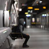 A customer waiting to board the Jubilee line