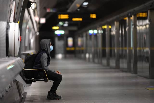 A customer waiting to board the Jubilee line