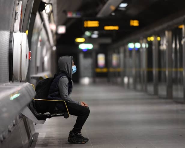 A customer waiting to board the Jubilee line
