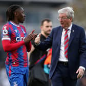 Eberechi Eze of Crystal Palace talks to Roy Hodgson, Manager of Crystal Palace, after the final whistle of the Premier League match (Photo by Steve Bardens/Getty Images)
