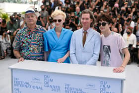 Bill Murray, British actress Tilda Swinton, Us director Wes Anderson and French-Us actor Timothee Chalamet pose during a photocall for the film "The French Dispatch" at the 74th edition of the Cannes Film Festival in Cannes, southern France, on July 13, 2021. (Photo by Christophe SIMON / AFP)