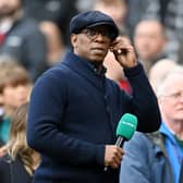 Ian Wright looks on during presenting duty for ITV Sport