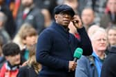 Ian Wright looks on during presenting duty for ITV Sport