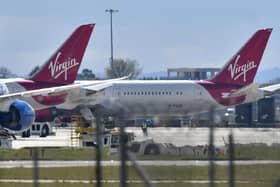 Virgin Atlantic passenger aircraft at Heathrow Airport. (Photo by BEN STANSALL/AFP via Getty Images)