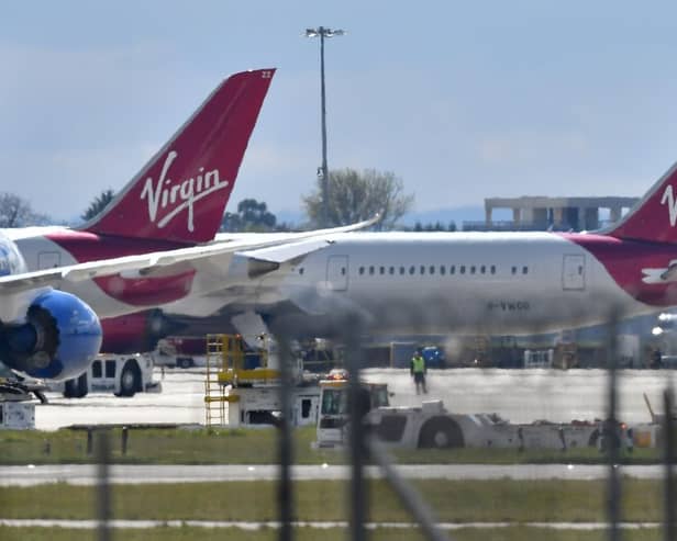 Virgin Atlantic passenger aircraft at Heathrow Airport. (Photo by BEN STANSALL/AFP via Getty Images)