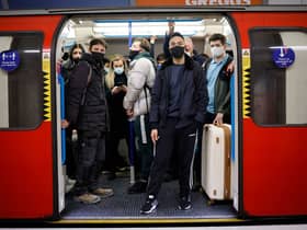 Commuters on the Tube in 2021. (Photo by TOLGA AKMEN/AFP via Getty Images)