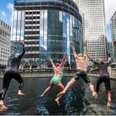 Swimmers jumping into Middle Dock. Credit: Canary Wharf Group.