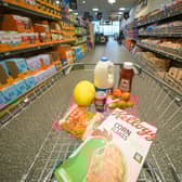 A shopping trolley filled with groceries from Aldi, which has been named the UK’s cheapest supermarket for 12 months in a row.