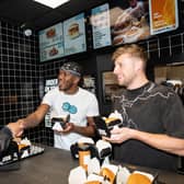 KSI serving burgers at Sides in Wembley. (Photo by Sides)