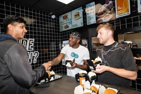 KSI serving burgers at Sides in Wembley. (Photo by Sides)