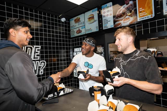 KSI serving burgers at Sides in Wembley. (Photo by Sides)