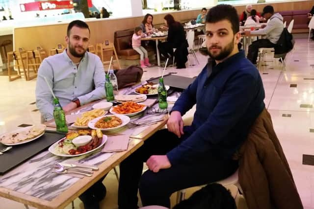 Omar Alhaj Ali (left) says he misses his brother Mohammad (right) every day