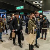Volunteer ‘passengers’ exit a carriage on to a platform during a test run of a Transport for London (TfL) Elizabeth Line train. Credit: Niklas Halle’n/AFP via Getty Images.