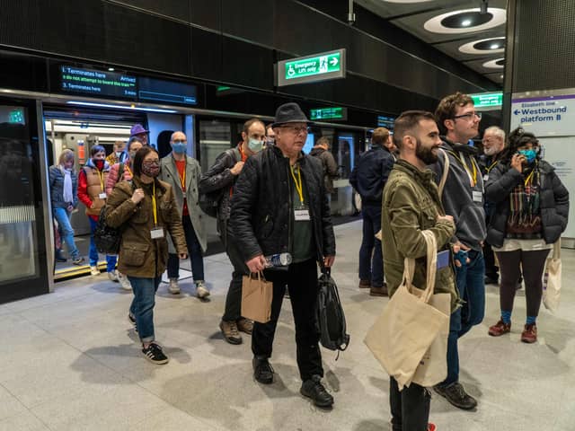Volunteer ‘passengers’ exit a carriage on to a platform during a test run of a Transport for London (TfL) Elizabeth Line train. Credit: Niklas Halle’n/AFP via Getty Images.