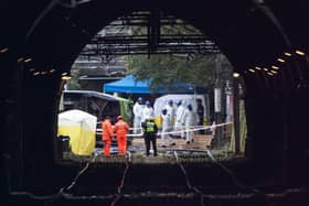 Emergency workers at the scene of the Croydon tram crash. (Photo by Carl Court/Getty Images)