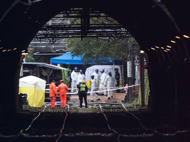 Emergency workers at the scene of the Croydon tram crash. (Photo by Carl Court/Getty Images)