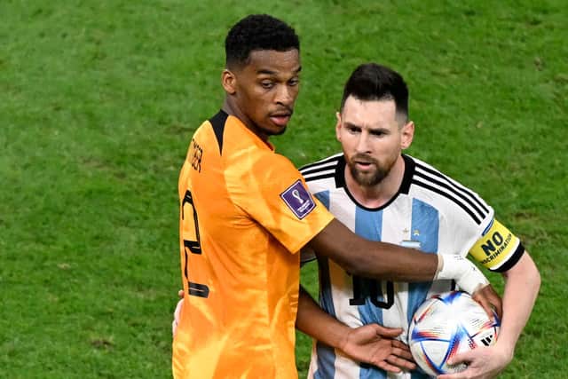 Jurrien Timber in action for Netherlands at the 2022 World Cup alongside Lionel Messi. Picture: PATRICIA DE MELO MOREIRA/AFP via Getty Images
