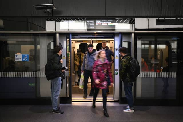 Let passengers off the train before boarding.  (Photo by DANIEL LEAL/AFP via Getty Images)