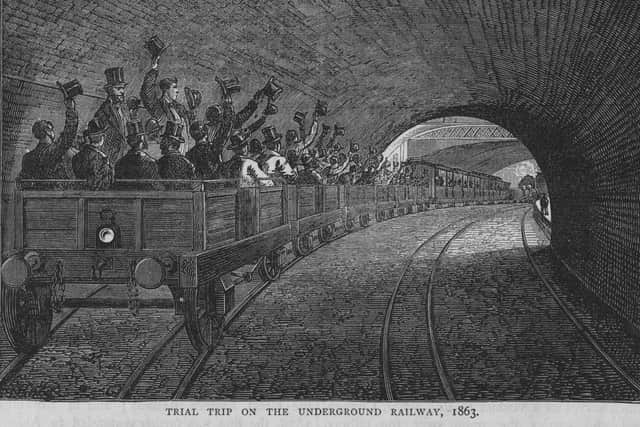 Commuters waving their hats in the air as they pass Portland Road station during a trial trip on the London Metropolitan Underground railway. Cassell’s ‘Old and London New’, 1863. (Photo by Hulton Archive/Getty Images)