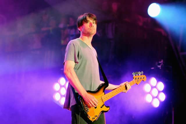 Alex James on stage with Blur at Glastonbury in 2009. (Photo by Jim Dyson/Getty Images)