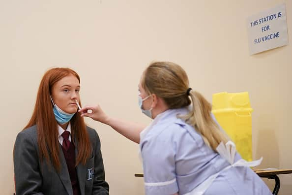 Secondary school children will now get to have their flu vaccinations to reduce the risk of transmission to more vulnerable groups. (Photo by Ian Forsyth/Getty Images)