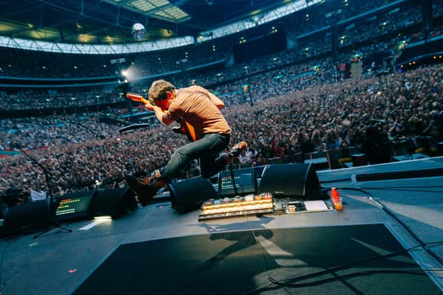 Graham Coxon with Blur at Wembley Stadium. (Photo by Phoebe Fox)