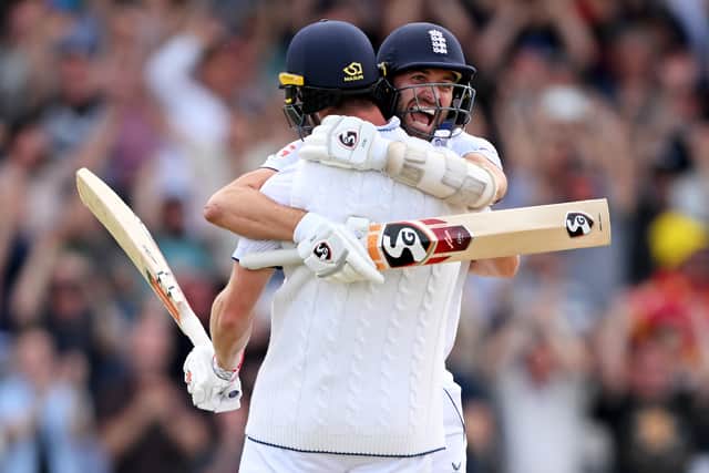 Chris Woakes of England celebrates with teammate Mark Wood after hitting the winning runs to win the LV= Insurance Ashes 3rd Test Match between England and Australia at Headingley on July 09, 2023 in Leeds, England. (Photo by Stu Forster/Getty Images)