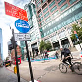 A cyclist riding through Bishopsgate. Credit: TfL.