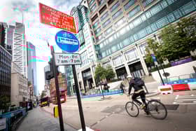 A cyclist riding through Bishopsgate. Credit: TfL.