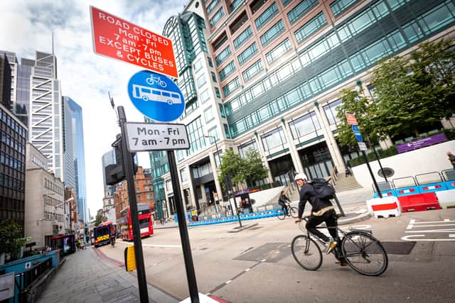 A cyclist riding through Bishopsgate. Credit: TfL.